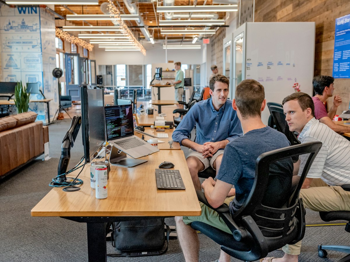 CSR team reviewing a live impact dashboard